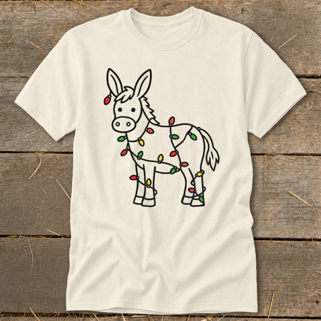 Cream t-shirt with a line drawing of a donkey wrapped in colorful Christmas lights.