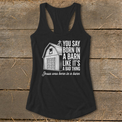 Black tank top with barn graphic and text "Jesus was born in a barn."