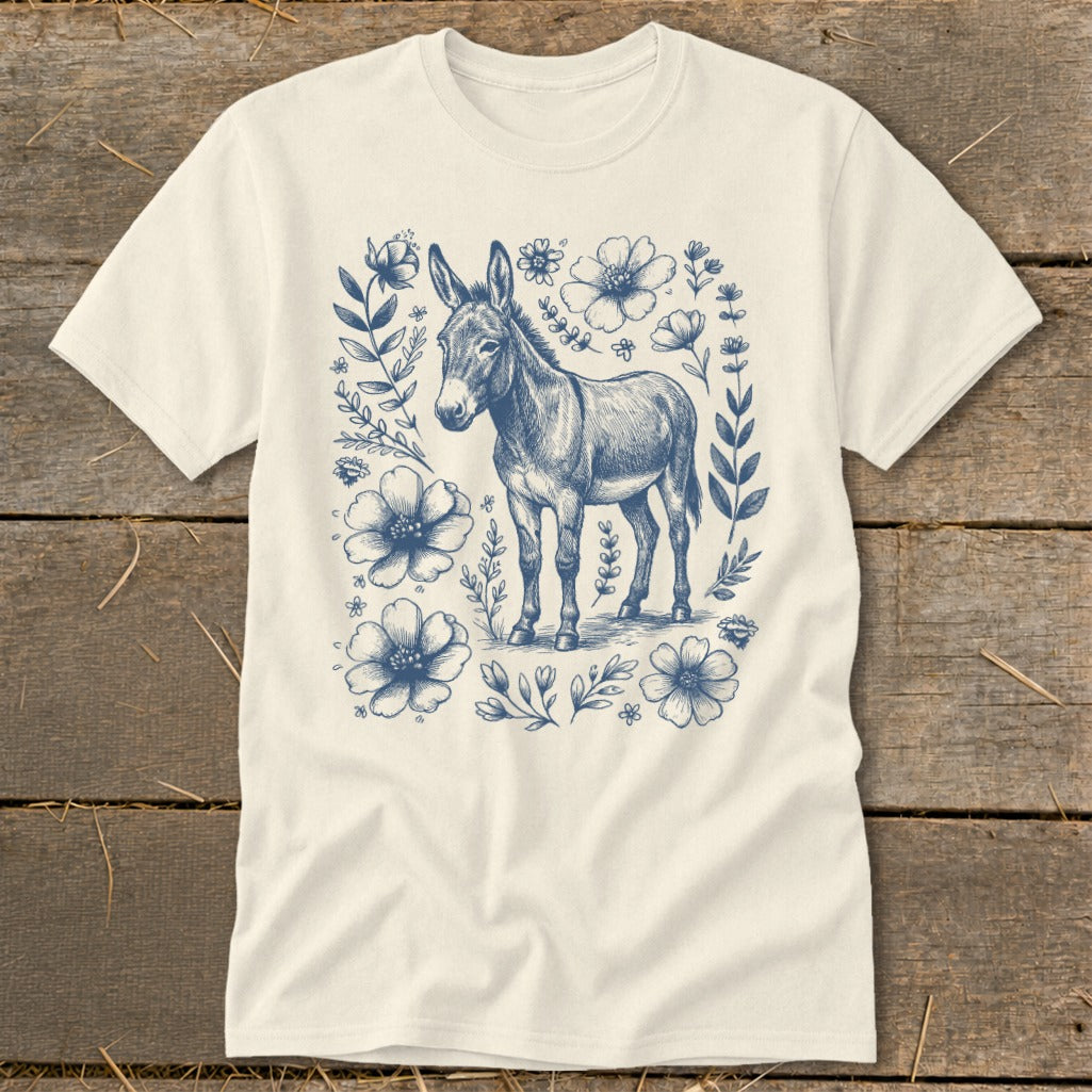 Cream t-shirt with blue donkey and floral sketch design.