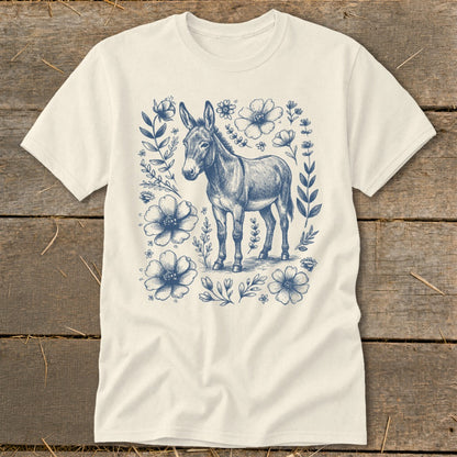 Cream t-shirt with blue donkey and floral sketch design.