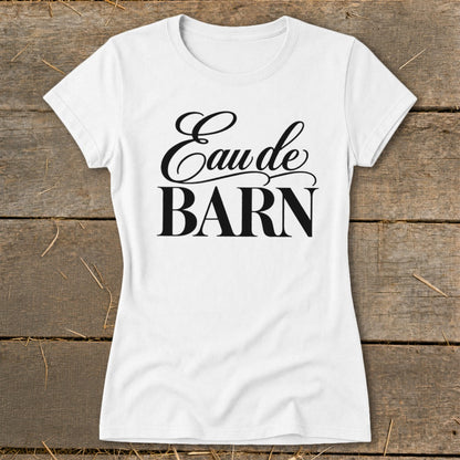 White t-shirt with black text reading "Eau de BARN"