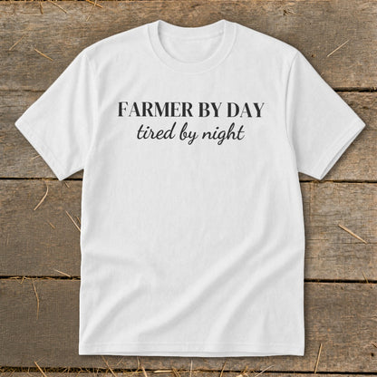 White t-shirt with "FARMER BY DAY tired by night" text.