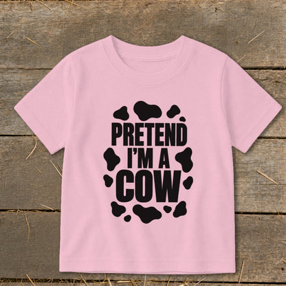 Pink t-shirt with black cow spots and text "PRETEND I'M A COW".