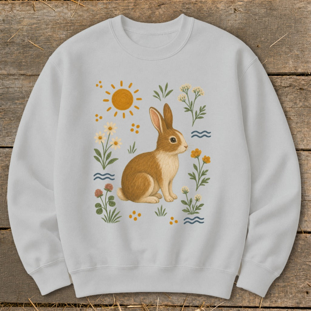Light grey sweatshirt with a brown rabbit and floral illustration.