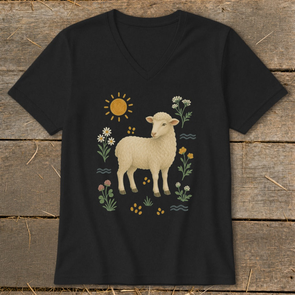 Black t-shirt with a drawing of a lamb surrounded by flowers, the sun, and water elements.