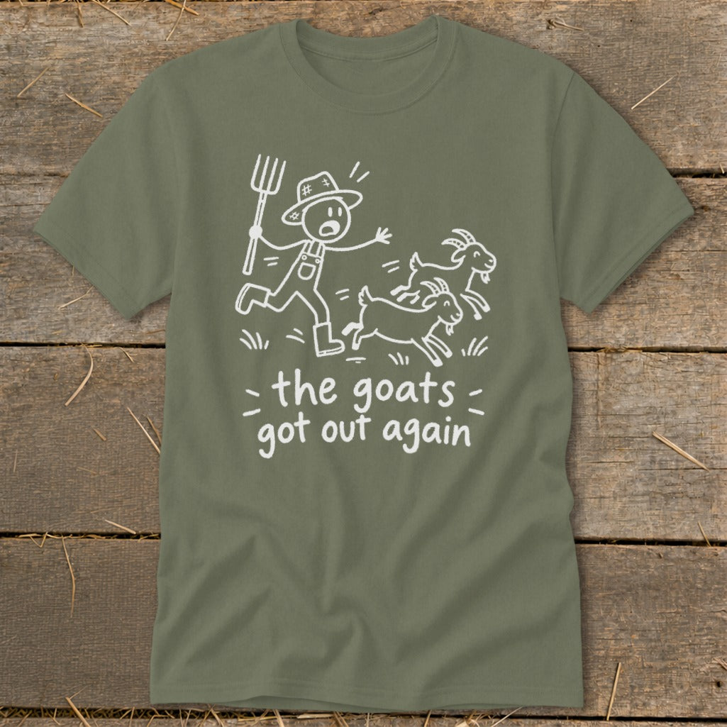 Green t-shirt with a white graphic of a farmer chasing three goats, saying "the goats got out again."
