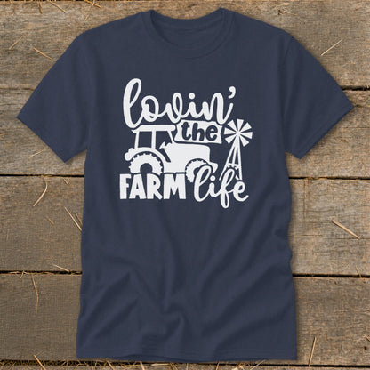 Navy t-shirt with white "lovin' the farm life" text, tractor, and windmill graphic.