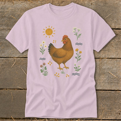 Pink t-shirt with a brown chicken illustration surrounded by flowers and the sun.