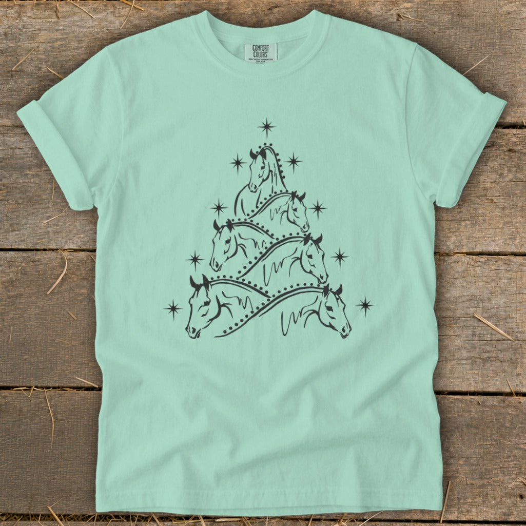 Mint t-shirt with a Christmas tree design made of horse heads and stars.