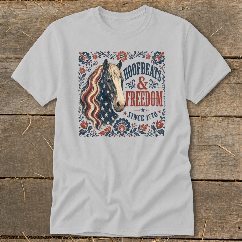 Light grey t-shirt with horse graphic featuring American flag mane and "Hoofbeats & Freedom Since 1776".