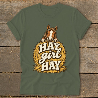 Green t-shirt with horse on hay bale graphic saying "HAY girl HAY".