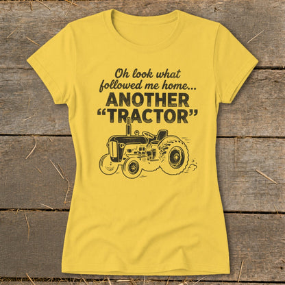 Yellow t-shirt with black graphic of a tractor and text.