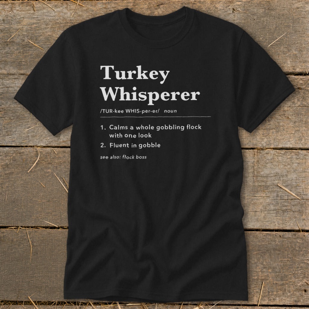 Black t-shirt with "Turkey Whisperer" definition: calms flock, fluent in gobble.
