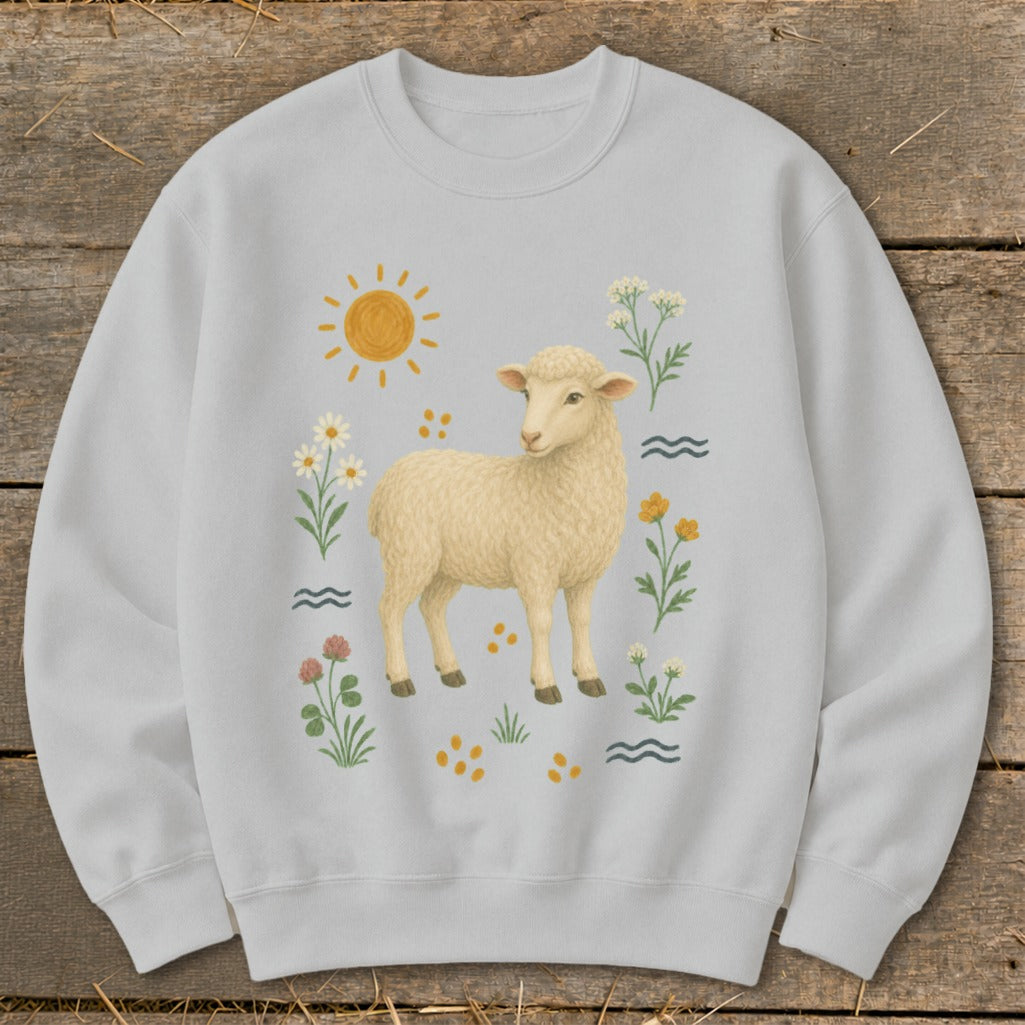 Light gray sweatshirt with a cream sheep illustration surrounded by flowers, sun, and wavy lines.