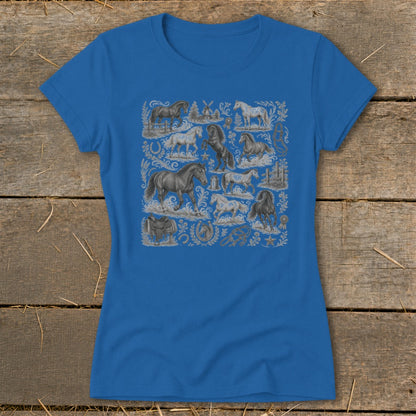 Blue t-shirt with a repeating pattern of horses, saddles, windmills, and horseshoes.