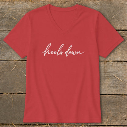 Red v-neck t-shirt with white "heels down" text.