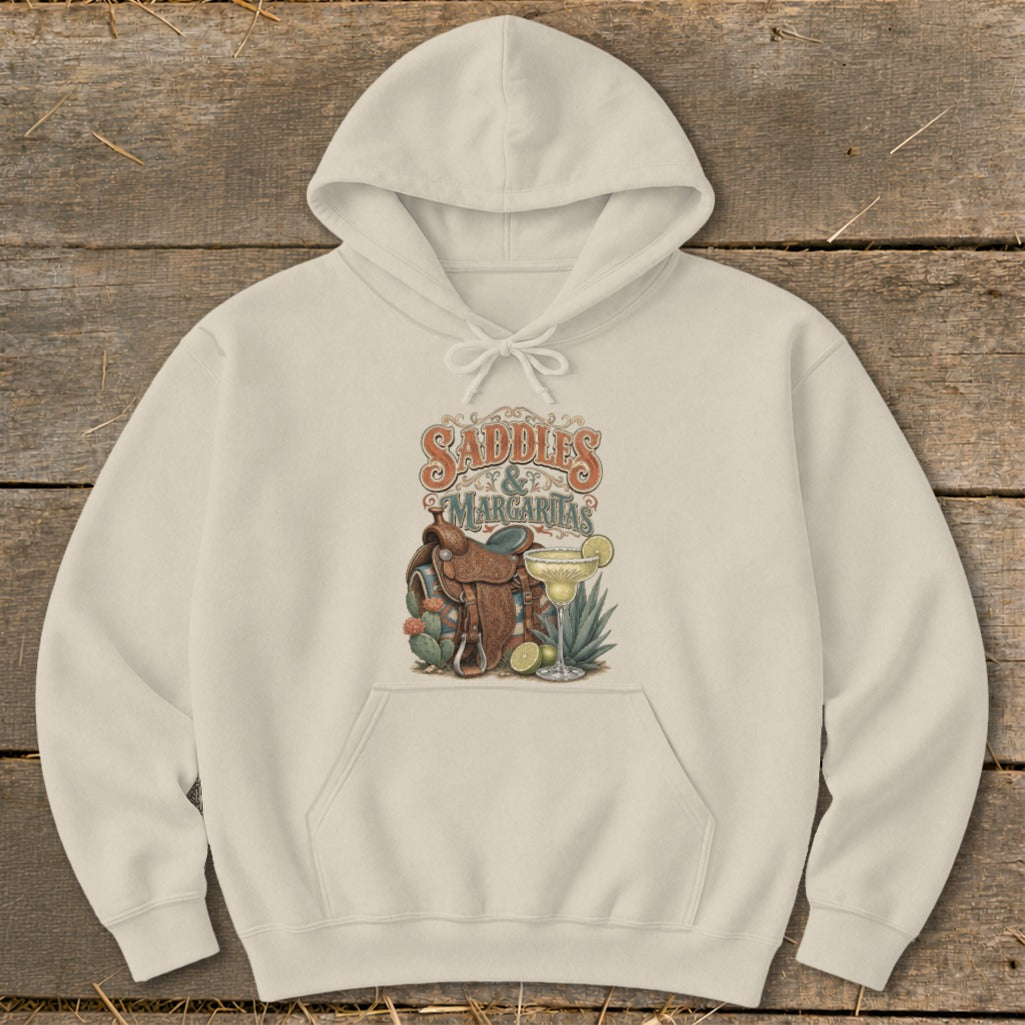 Cream hoodie with "Saddles & Margaritas" graphic, including a saddle, cacti, and margarita.