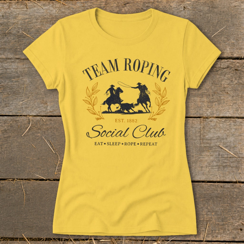 Yellow t-shirt with "Team Roping Social Club" text and roping graphic.