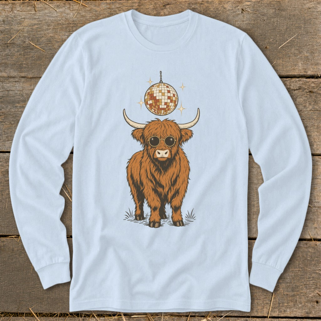 Highland cow wearing sunglasses with disco ball above, on light blue long sleeve shirt.