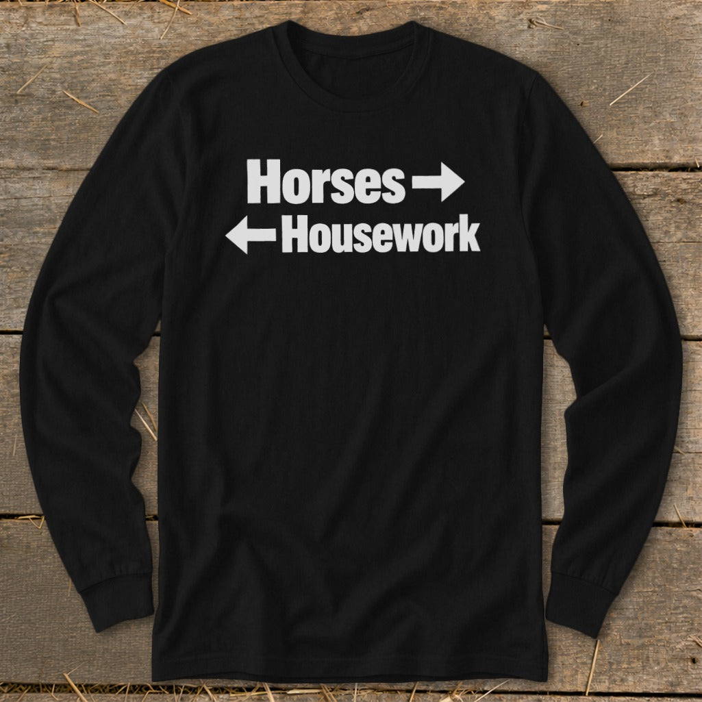 Black long-sleeve t-shirt with white text reading Horses with a right arrow and Housework with a left arrow.