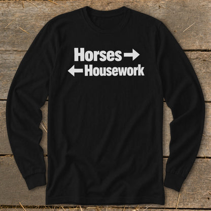 Black long-sleeve t-shirt with white text reading Horses with a right arrow and Housework with a left arrow.