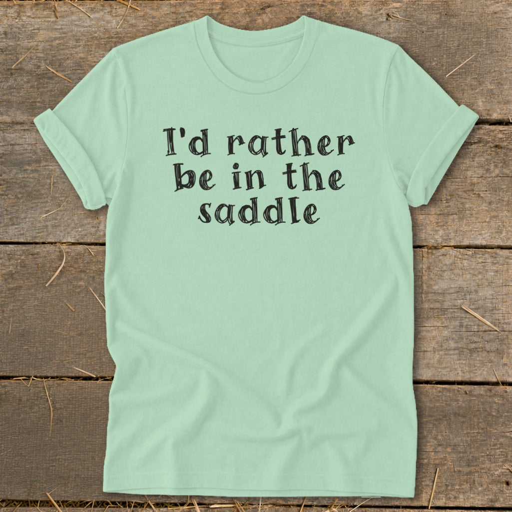 Light mint t-shirt with black text reading "I'd rather be in the saddle."