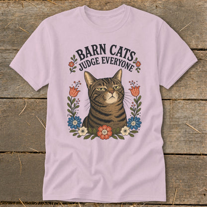 Pink t-shirt with a grumpy tabby cat and "Barn Cats Judge Everyone" text.