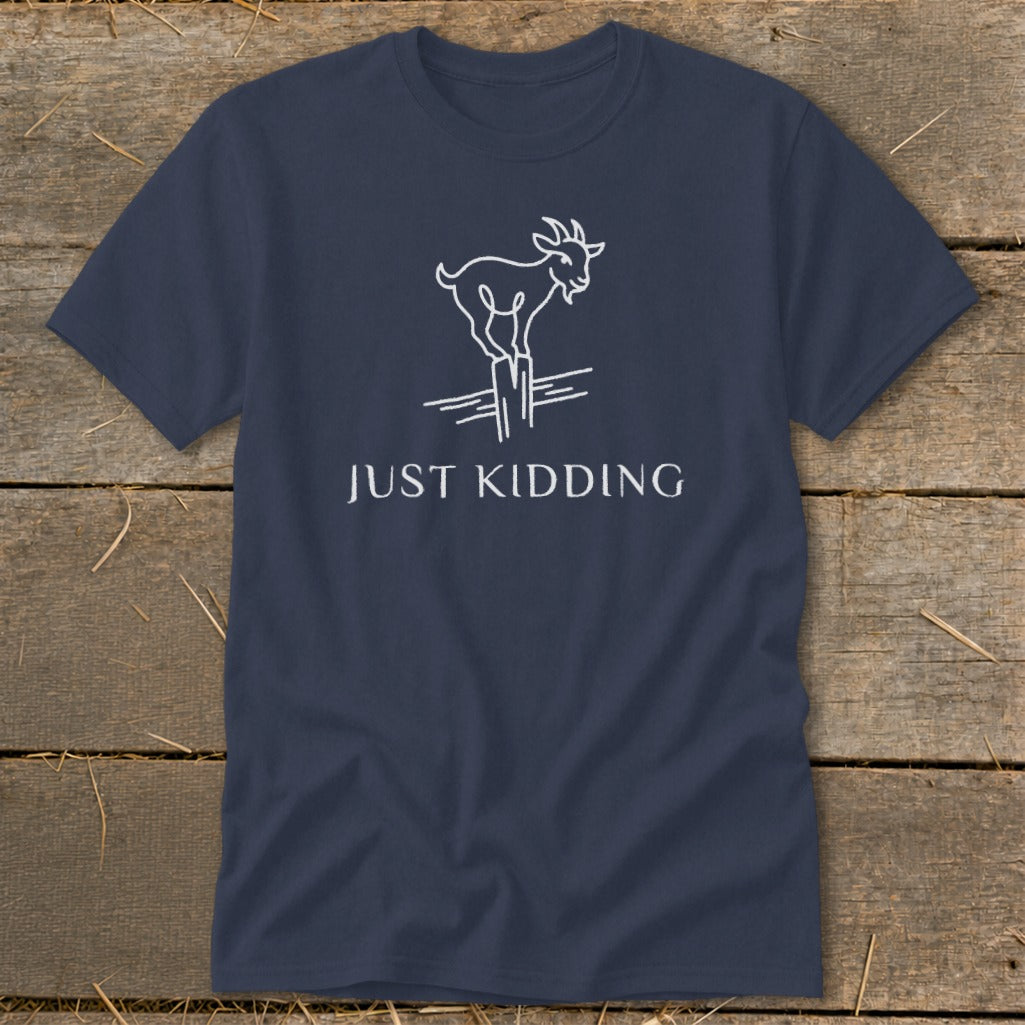 Navy t-shirt with white line drawing of goat on fence and text "JUST KIDDING".