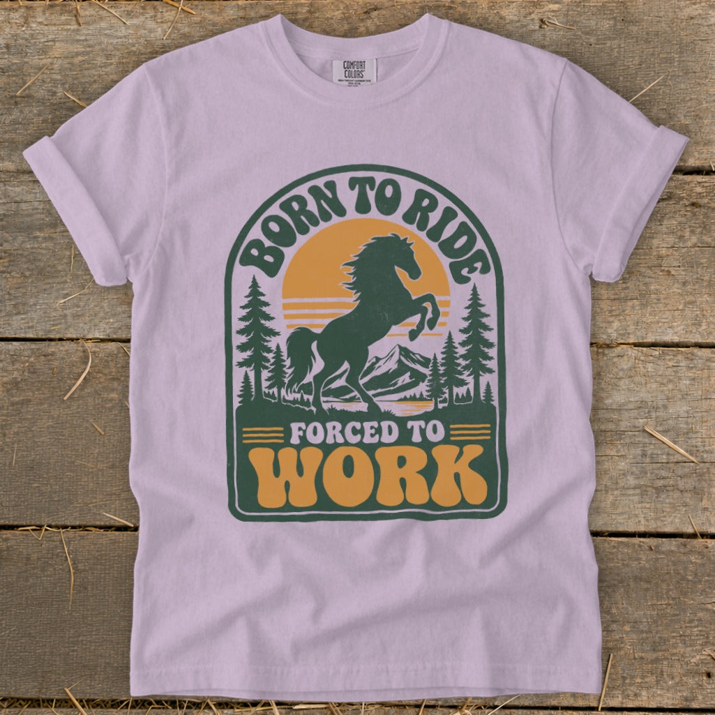 T-shirt graphic with horse, mountains, and text "Born to Ride Forced to Work".