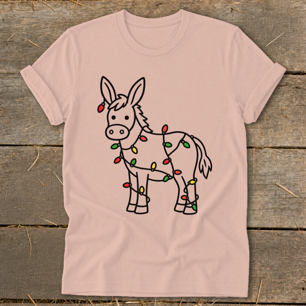 Donkey wearing a string of red, green, and yellow Christmas lights.