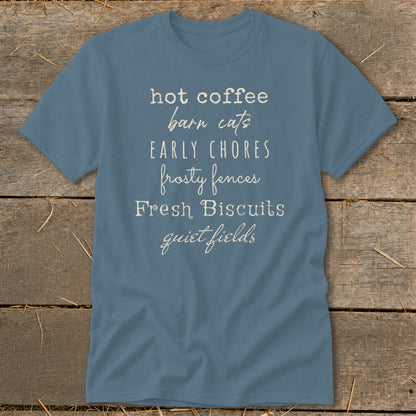 Blue t-shirt with text listing "hot coffee," "barn cats," "early chores," "frosty fences," "Fresh Biscuits," and "quiet fields."