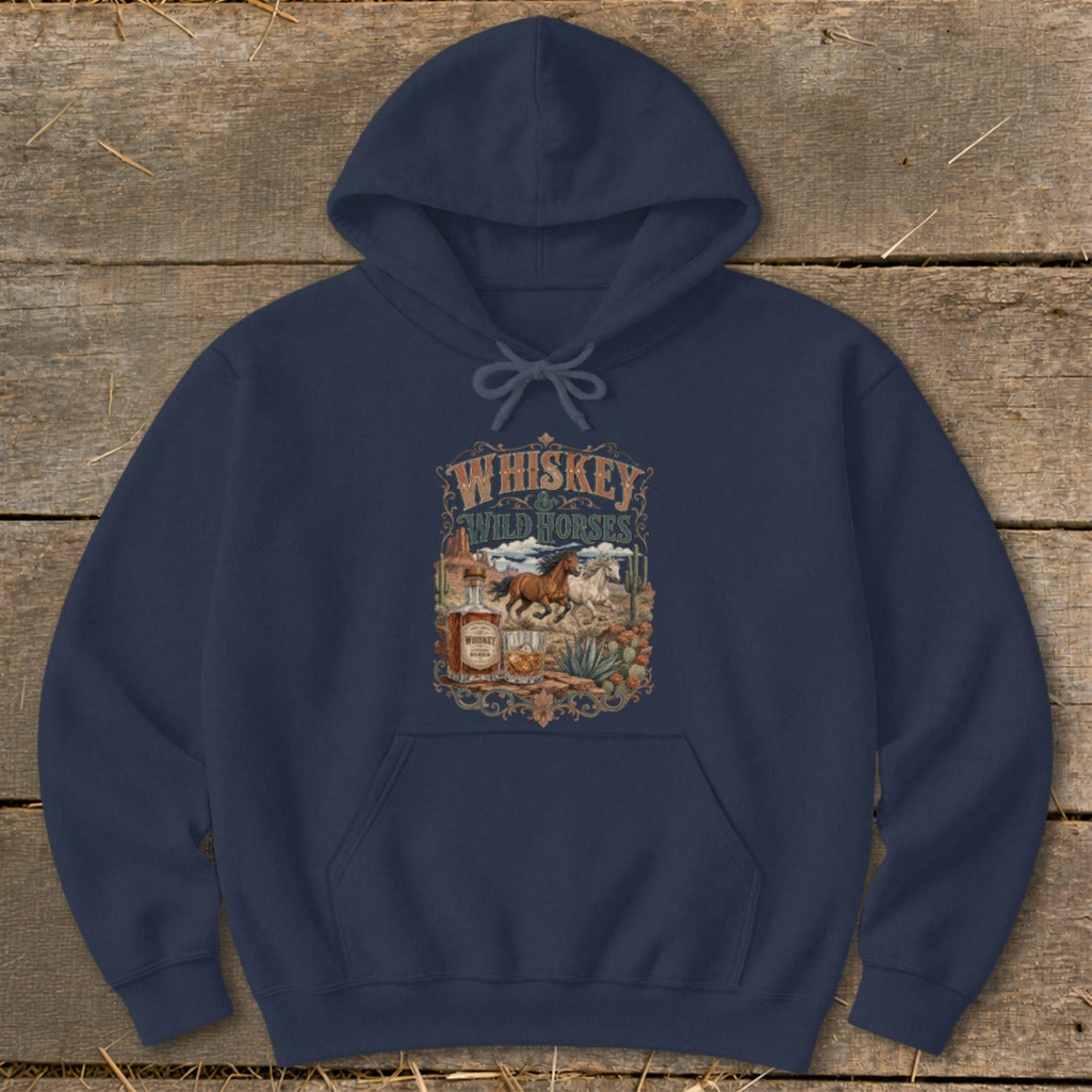Navy hoodie with "Whiskey Wild Horses" graphic featuring horses, whiskey bottle, and desert plants.