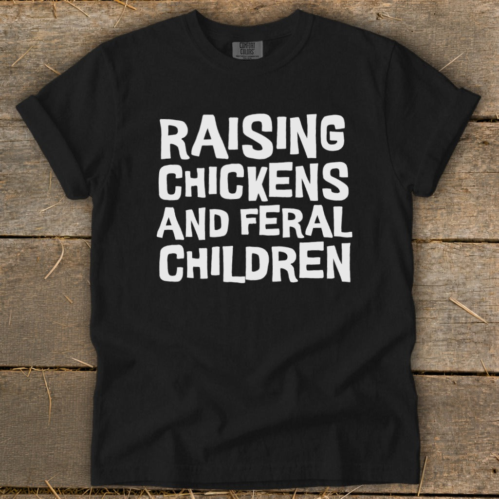Black t-shirt with white text "Raising Chickens and Feral Children".