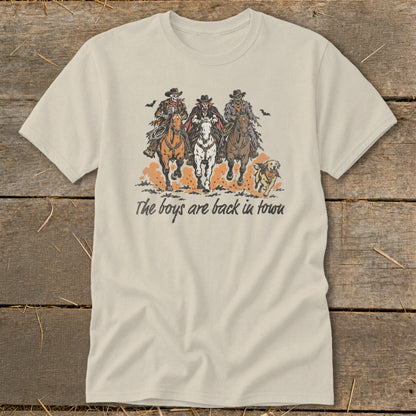 Three undead cowboys on horseback with text "The boys are back in town" and a dog.