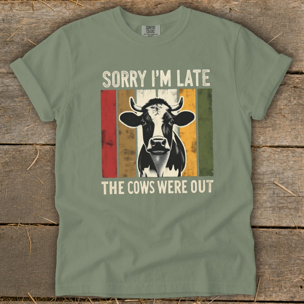 T-shirt with a cow graphic and the text "Sorry I'm Late, The Cows Were Out".