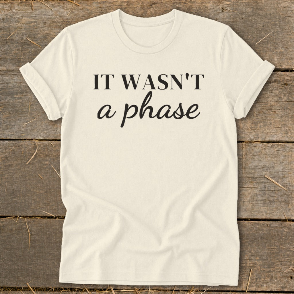 Cream t-shirt with black text "IT WASN'T a phase".
