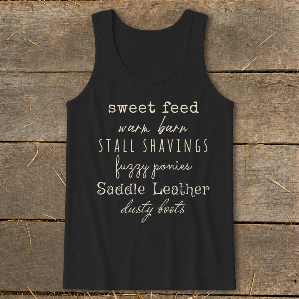 Black tank top with text listing equestrian elements like fuzzy ponies and dusty boots.