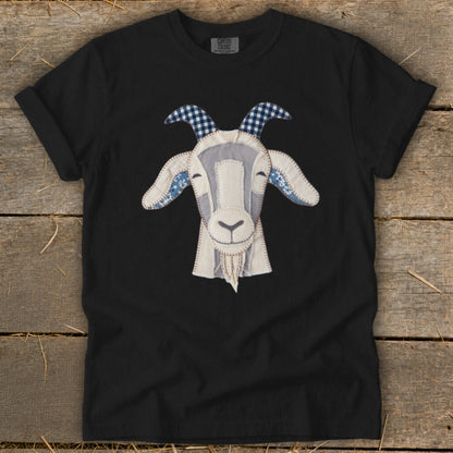 Black t-shirt with a stitched goat face graphic in white and blue patterns.