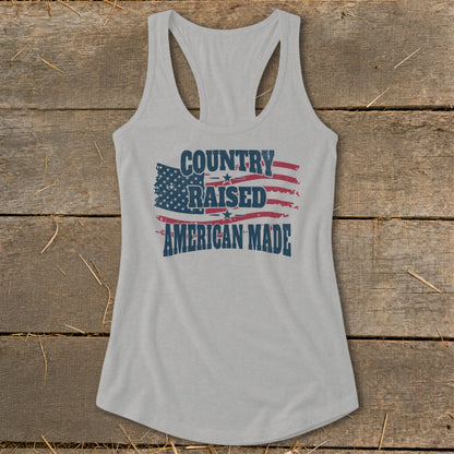 Gray tank top with distressed American flag graphic and text "COUNTRY RAISED AMERICAN MADE".