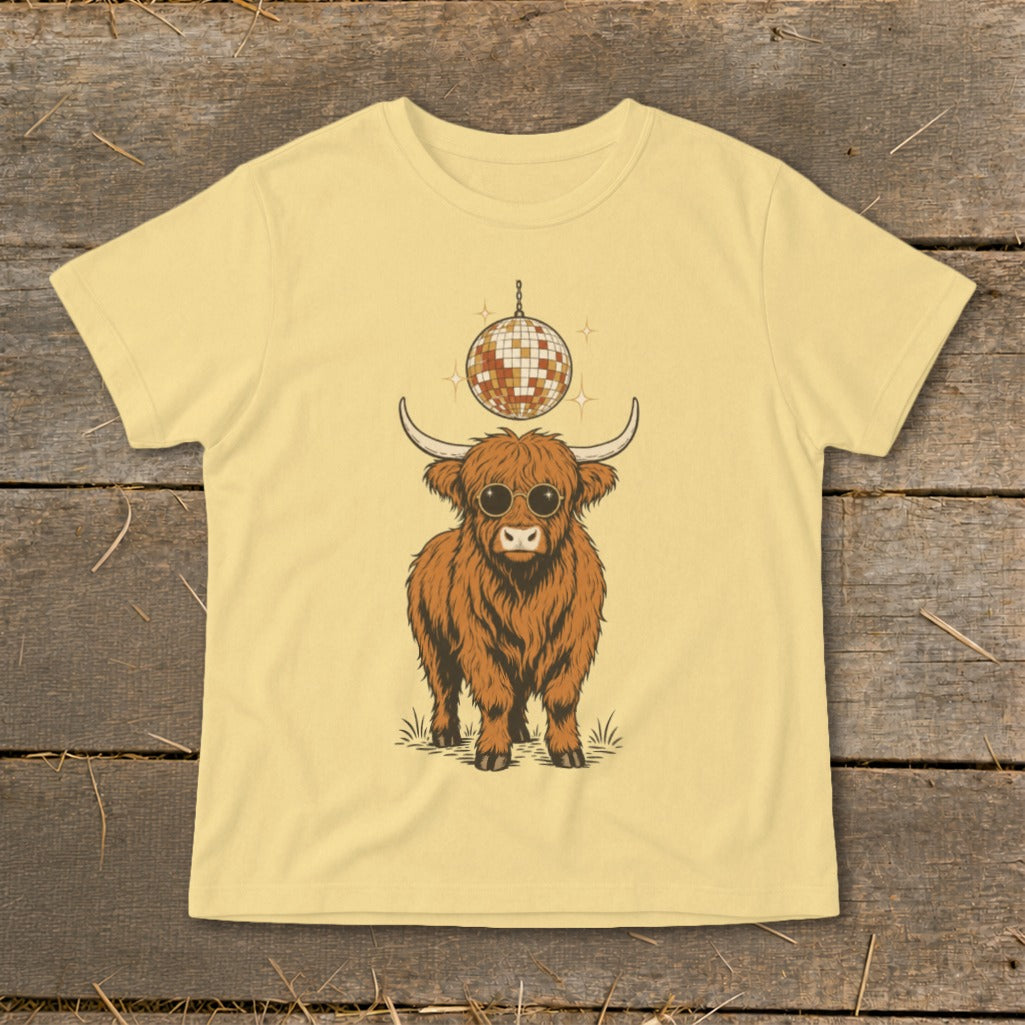 Highland cow with sunglasses and disco ball on a yellow t-shirt.