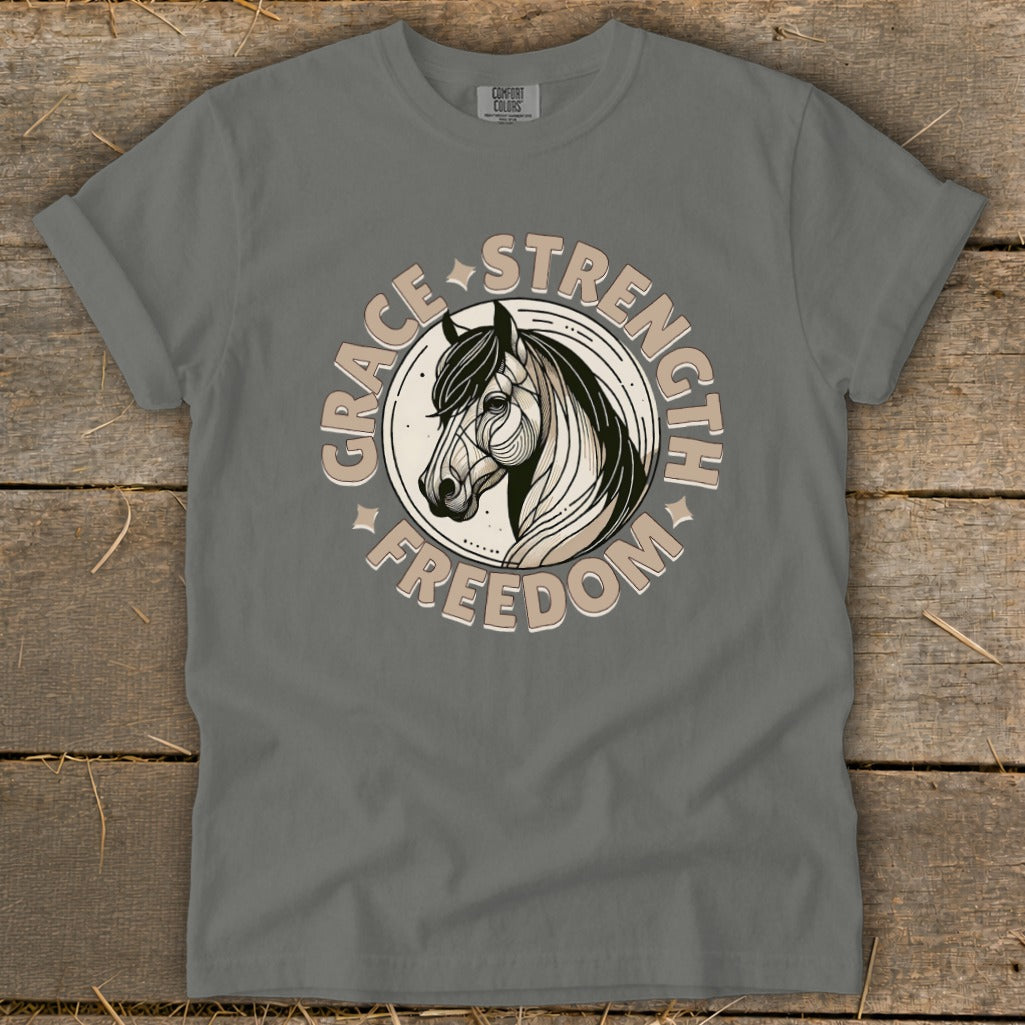 Gray t-shirt with a circular graphic featuring a horse head and text GRACE STRENGTH FREEDOM.