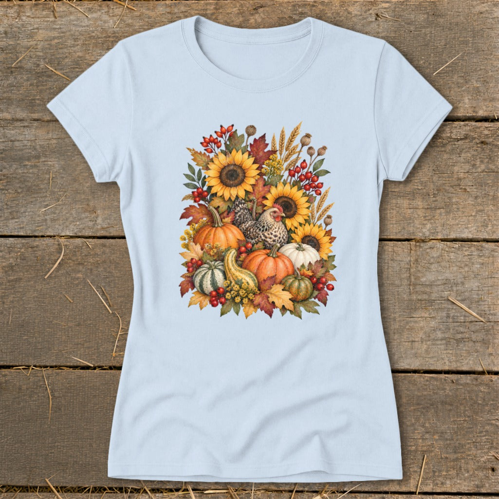 Light blue t-shirt with a fall harvest illustration of sunflowers, pumpkins, gourds, and chickens.