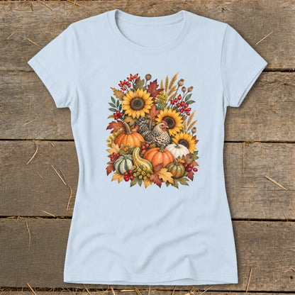 Light blue t-shirt with a fall harvest illustration of sunflowers, pumpkins, gourds, and chickens.