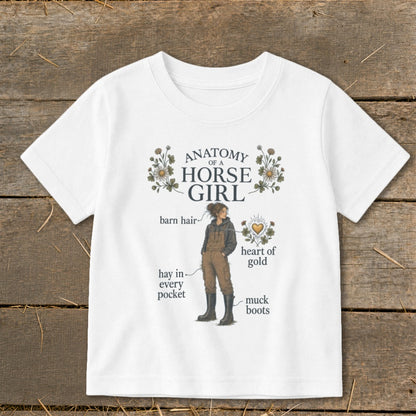 White t-shirt with "Anatomy of a Horse Girl" graphic, featuring a girl and labeled anatomy.