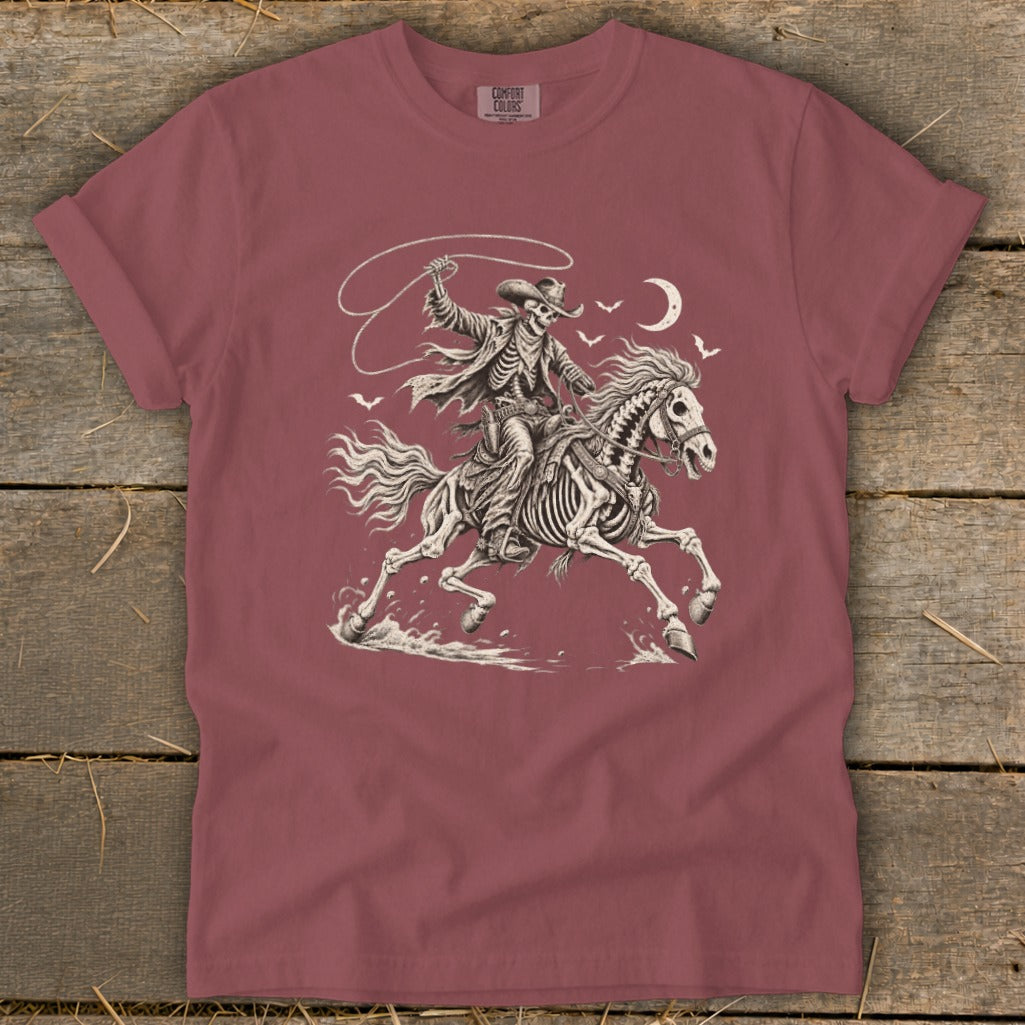 Skeleton cowboy on horse with lasso under moon and bats.