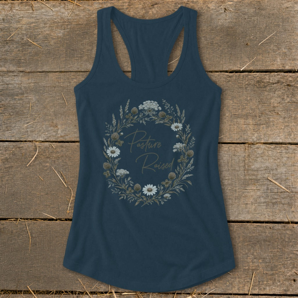 Dark blue tank top with a floral wreath graphic that says "Pasture Raised".
