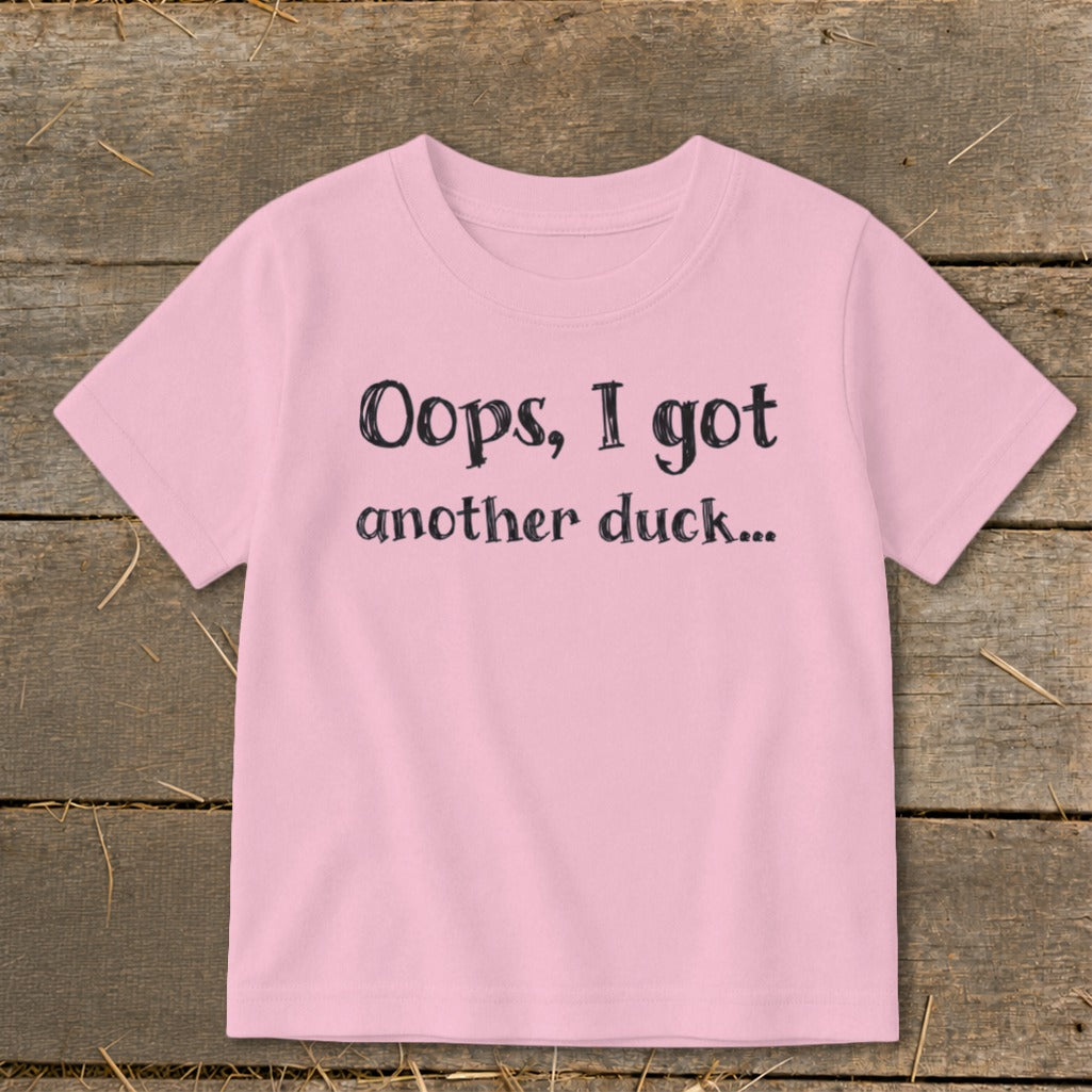 Pink t-shirt with black text "Oops, I got another duck..."