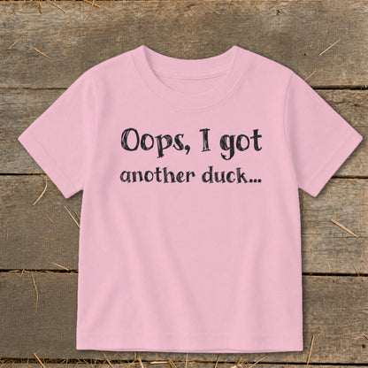 Pink t-shirt with black text "Oops, I got another duck..."