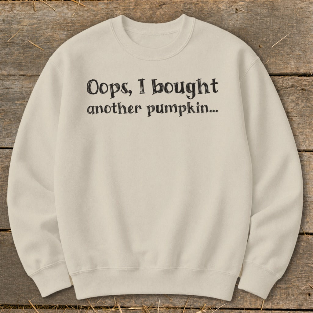 Cream sweatshirt with "Oops, I bought another pumpkin..." text.