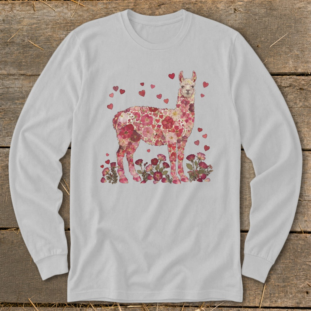 Long sleeve shirt with a llama covered in pink flowers and hearts.